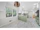 Bright kitchen with white cabinets and a view into the dining area at 3573 Clubhouse Ln, Conyers, GA 30094