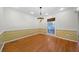Charming dining room with hardwood floors and floral wallpaper at 3573 Clubhouse Ln, Conyers, GA 30094