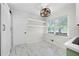 Eat-in kitchen with white cabinets and marble-look floors at 3573 Clubhouse Ln, Conyers, GA 30094