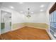 Bright dining room with hardwood floors and yellow floral wallpaper at 3573 Clubhouse Ln, Conyers, GA 30094