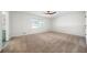 Bright bedroom with carpet, ceiling fan, and access to bathroom at 3573 Clubhouse Ln, Conyers, GA 30094