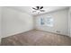 Bedroom with neutral walls, carpet, and a ceiling fan at 3573 Clubhouse Ln, Conyers, GA 30094