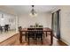 Bright dining room with hardwood floors and a view into the kitchen at 1195 Vineyard Se Dr, Conyers, GA 30013