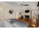 Main bedroom with fireplace, hardwood floors and access to the bathroom at 1195 Vineyard Se Dr, Conyers, GA 30013