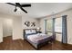 Bedroom with a queen bed, ceiling fan, and plenty of natural light at 1195 Vineyard Se Dr, Conyers, GA 30013