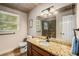 Bathroom with granite vanity, walk-in shower, and tile floor at 1195 Vineyard Se Dr, Conyers, GA 30013