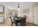 Charming breakfast nook with a round table and four chairs, adjacent to the kitchen at 1195 Vineyard Se Dr, Conyers, GA 30013
