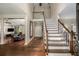 Two-story foyer with hardwood floors and staircase at 1195 Vineyard Se Dr, Conyers, GA 30013
