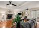 Open living room featuring hardwood floors, fireplace, and comfortable seating at 1195 Vineyard Se Dr, Conyers, GA 30013