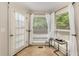 Cozy breakfast nook with access to the backyard, featuring a small table and chairs at 1195 Vineyard Se Dr, Conyers, GA 30013