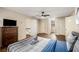 Spacious bedroom with a queen bed, dresser, and access to a hallway at 1195 Vineyard Se Dr, Conyers, GA 30013