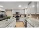 Spacious kitchen featuring granite countertops, stainless steel appliances, and ample cabinetry at 1195 Vineyard Se Dr, Conyers, GA 30013