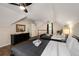 Spacious bedroom with two beds, dresser, and hardwood floors at 1195 Vineyard Se Dr, Conyers, GA 30013