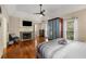 Main bedroom with fireplace, hardwood floors and large windows at 1195 Vineyard Se Dr, Conyers, GA 30013