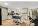 Modern kitchen with white cabinets, granite countertops, and island at 1195 Vineyard Se Dr, Conyers, GA 30013