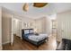 Bedroom with a queen bed, ceiling fan, and access to closets at 1195 Vineyard Se Dr, Conyers, GA 30013
