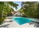 Large swimming pool with diving board in a private backyard setting at 1195 Vineyard Se Dr, Conyers, GA 30013