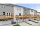 Rear view of townhouses with private decks and garages at 1029 Cades Walk, Lawrenceville, GA 30045