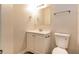 Clean bathroom with vanity, toilet, and mirrored medicine cabinet at 6635 Shapiro Ct, Stone Mountain, GA 30087