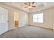 Main bedroom with private bathroom access and carpet at 6635 Shapiro Ct, Stone Mountain, GA 30087