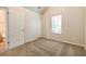 Bright bedroom with neutral walls, carpet, and ample closet space at 6635 Shapiro Ct, Stone Mountain, GA 30087