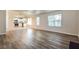 Open living room and kitchen with luxury vinyl plank flooring at 6635 Shapiro Ct, Stone Mountain, GA 30087