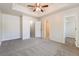 Spacious main bedroom with walk-in closet and carpet at 6635 Shapiro Ct, Stone Mountain, GA 30087