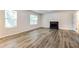 Spacious living room with fireplace and hardwood floors at 6635 Shapiro Ct, Stone Mountain, GA 30087