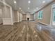 Spacious great room featuring hardwood floors and a fireplace at 2900 Brandford Trl, Locust Grove, GA 30248