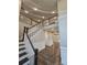 Two-story entryway with a grand staircase and dark hardwood floors at 2900 Brandford Trl, Locust Grove, GA 30248