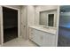 Bathroom with single vanity, quartz countertop and a closet at 2900 Brandford Trl, Locust Grove, GA 30248