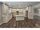 White kitchen with stainless steel appliances and island at 2900 Brandford Trl, Locust Grove, GA 30248