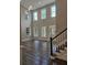 Spacious living room with high ceilings, large windows, and hardwood floors at 2900 Brandford Trl, Locust Grove, GA 30248