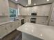 Spacious kitchen with white cabinets, quartz countertops, and an island at 2900 Brandford Trl, Locust Grove, GA 30248