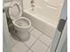 Clean bathroom with a toilet, bathtub, and tiled floor at 2900 Brandford Trl, Locust Grove, GA 30248
