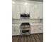 Modern kitchen with stainless steel range and microwave at 2900 Brandford Trl, Locust Grove, GA 30248