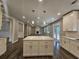 Large kitchen island with white cabinets and quartz countertop at 2900 Brandford Trl, Locust Grove, GA 30248