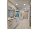 Double vanity bathroom with white cabinets and a large soaking tub at 2900 Brandford Trl, Locust Grove, GA 30248