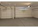 Two-car garage with epoxy flooring and storage at 2900 Brandford Trl, Locust Grove, GA 30248