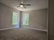 Spacious bedroom with carpet, ceiling fan, and large windows at 2900 Brandford Trl, Locust Grove, GA 30248