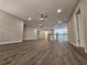 Spacious loft offering hardwood floors, multiple access points, and a ceiling fan at 2900 Brandford Trl, Locust Grove, GA 30248