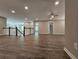Open loft area with hardwood floors, ceiling fan, and access to bedrooms at 2900 Brandford Trl, Locust Grove, GA 30248