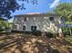 Tan house exterior with landscaping and trees at 2900 Brandford Trl, Locust Grove, GA 30248