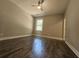 Bedroom with hardwood floors and a large window at 2900 Brandford Trl, Locust Grove, GA 30248