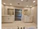 Double vanity bathroom with quartz countertops and white cabinets at 2900 Brandford Trl, Locust Grove, GA 30248