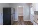 Kitchen with stainless steel refrigerator and view into adjacent living area at 2812 Mitchell Dr, Decatur, GA 30032