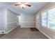 Living room with carpet, large windows, and ceiling fan at 2812 Mitchell Dr, Decatur, GA 30032