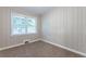 Bedroom with wood paneling and carpet flooring at 2812 Mitchell Dr, Decatur, GA 30032