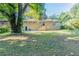 Spacious backyard with large tree and grassy area at 2812 Mitchell Dr, Decatur, GA 30032