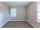 Spacious bedroom with neutral carpeting and a window at 2812 Mitchell Dr, Decatur, GA 30032